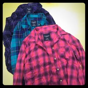Three plaid American Eagle shirts